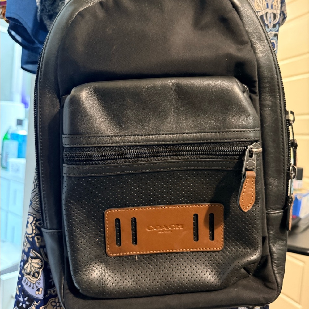 Coach Black Leather Sling Backpack with Tan Accent